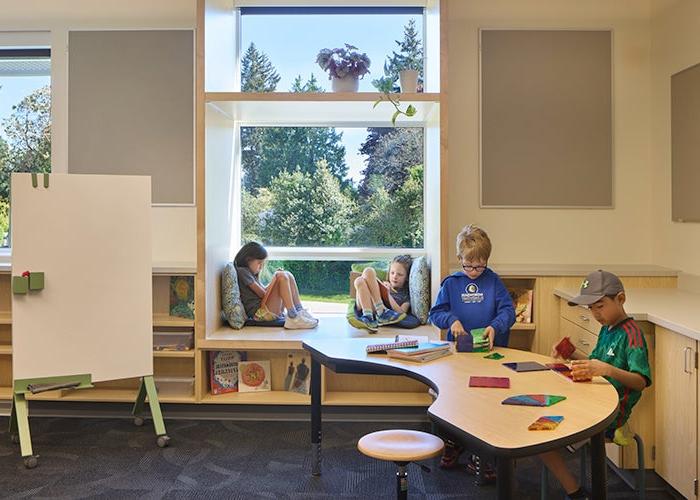 a classroom with students at a curved table